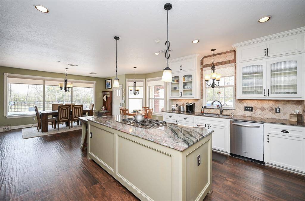 Kitchen island with over head lighting. And burners.