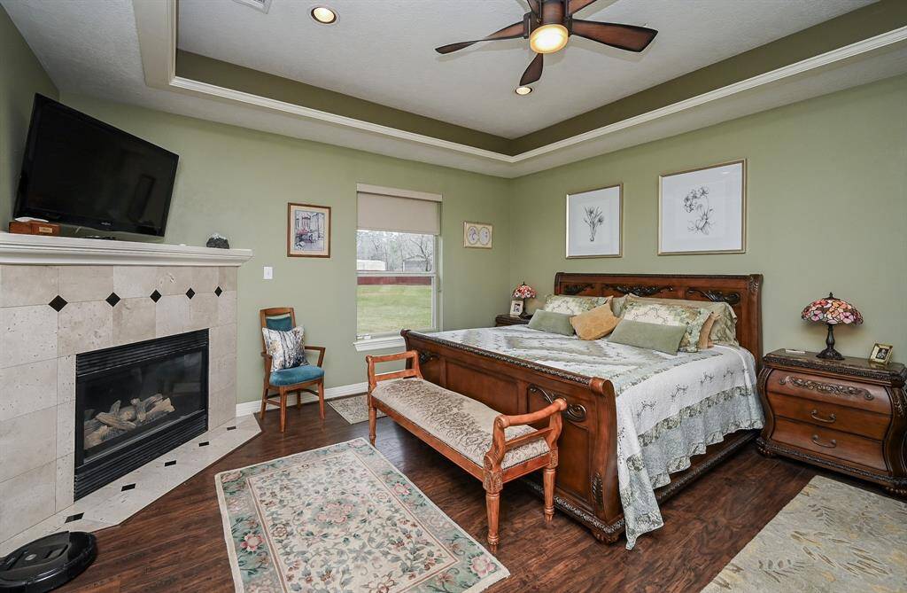 Primary bedroom has a fireplace. Large enough for king size bed and suit.