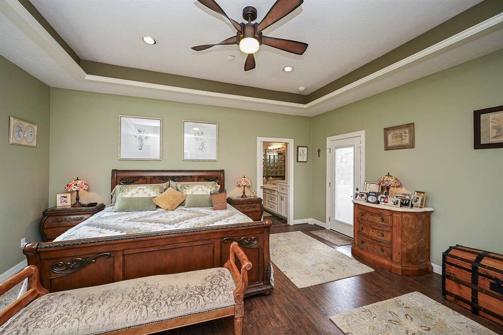 Primary bedroom has entry access to patio and pool.