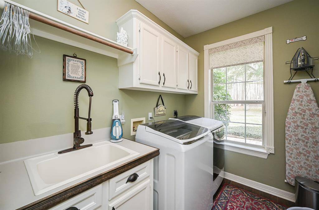 Utility room located in main house with a sink, and large enough to hold all cleaning equipment.