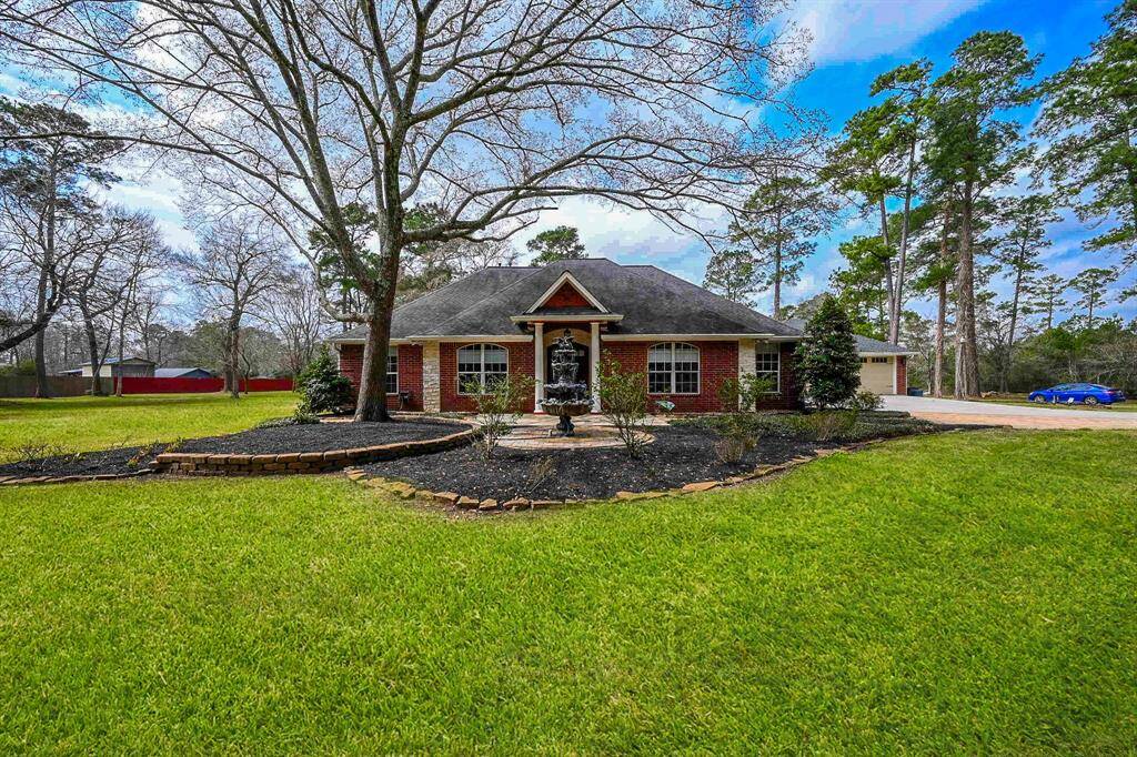 Front exterior elevation with water fountain. Beautiful grass for summer time. Bocce ball or volleyball is calling or farm to table garden!