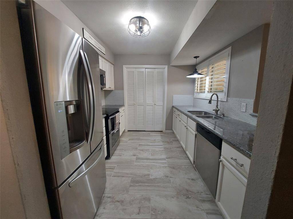 Recent Tile FLooring thru out the kitchen with Granite counter tops and built in microwave, and Free standing electric Confection oven and upper oven for that baker in the family!