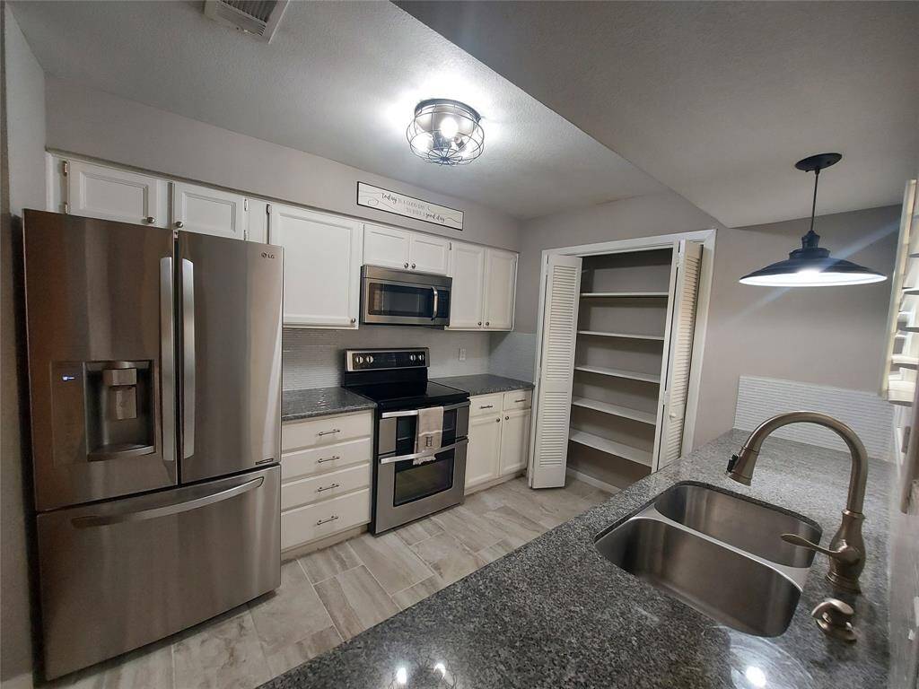 All wood cabinets and we have  pull out stainless slide outs for easy access in the lower cabinets!
