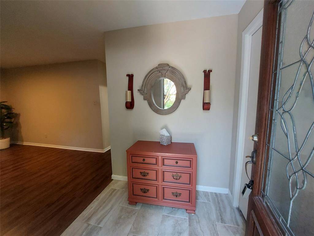 This is the entrance to your new townhome! Recent vinyl floors in the living room and entry has tile.