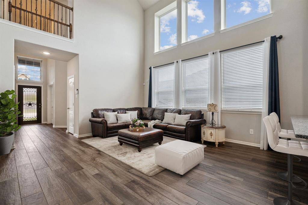 Enhanced: Family room open to Breakfast bar and Kitchen