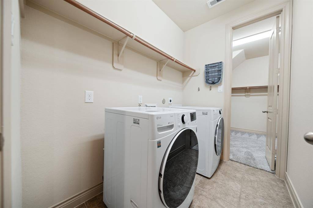 Spacious laundry room w/ direct access to the primary closet!