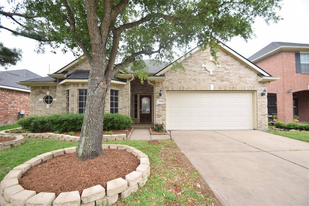 Front view of this enchanting home located at 24239 Yelverton Glen.