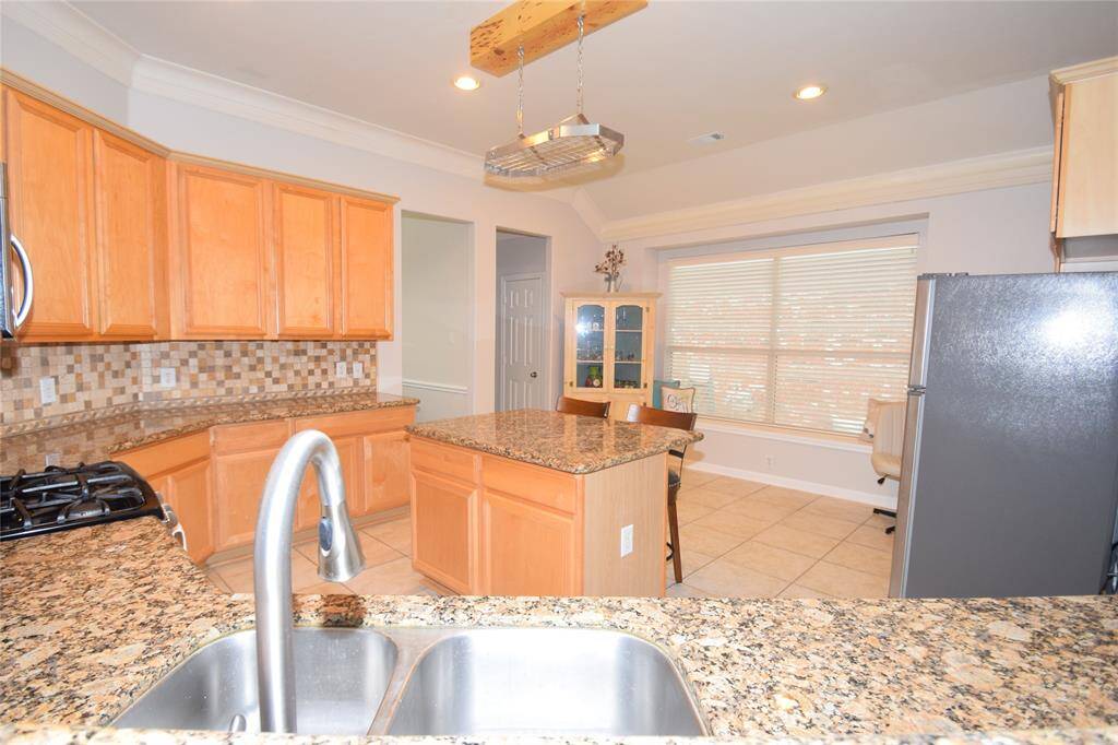 Kitchen opening to the breakfast room.