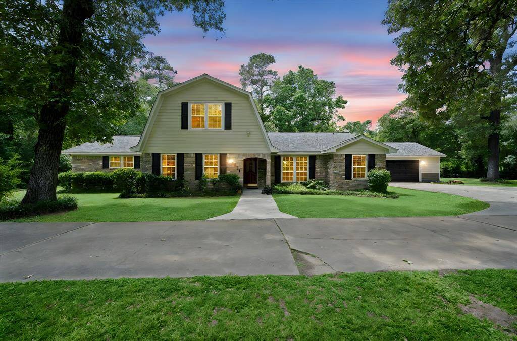 Nestled on a lush, wooded 1+ acre lot in the community of Allenwood, this rare gem combines privacy, natural beauty, and timeless curb appeal with its circle drive way and additional parking.