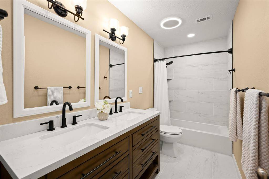 Bath 2 has been fully updated. Updates include vanity with double sinks and stacked drawers, tile surround, tub, toilet, flooring, faucets/fixtures, framed mirrors AND the cirlce light has a bluetooth speaker to listen to music while getting ready for the day.