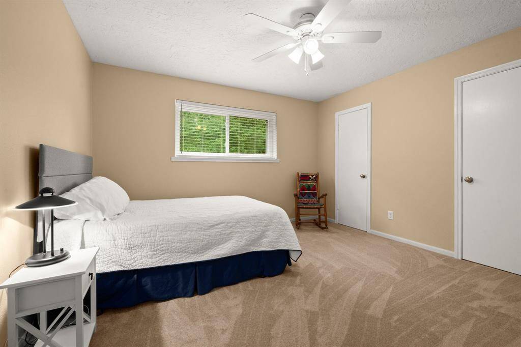 Bedroom 3 sits upstairs and includes plush carpet, large window overlooking the front yard, ceiling fan, plush carpet and 2" blinds.