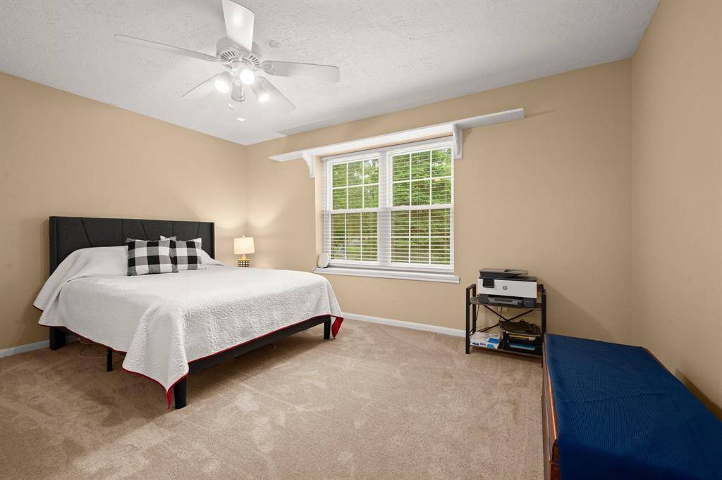 Bedroom 3 sits upstairs and includes plush carpet, large window overlooking the front yard, ceiling fan, plush carpet and 2" blinds.