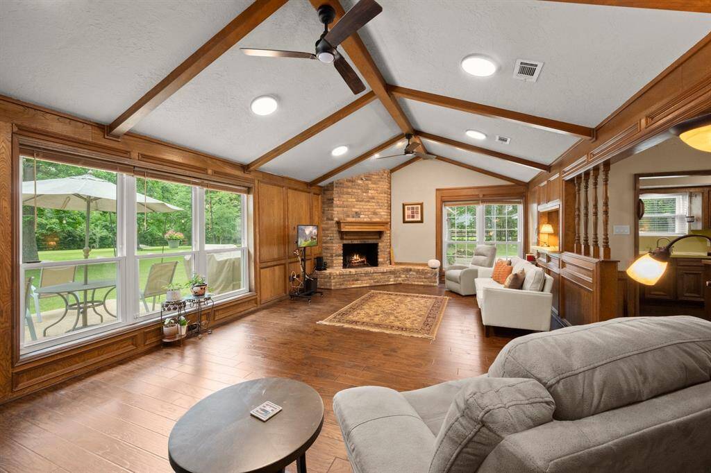 A stunning view and vaulted ceilings make this spacious room feel bright, open, and inviting.