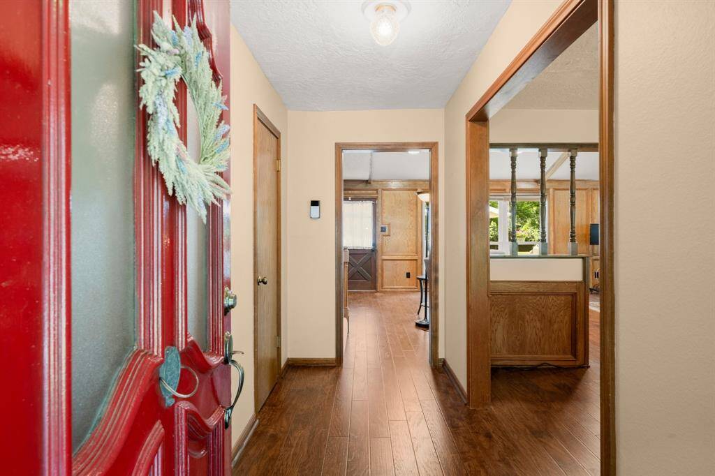 Warm wood floors and timeless paneling give this space a hearty, Texas-style welcome that feels just like home.