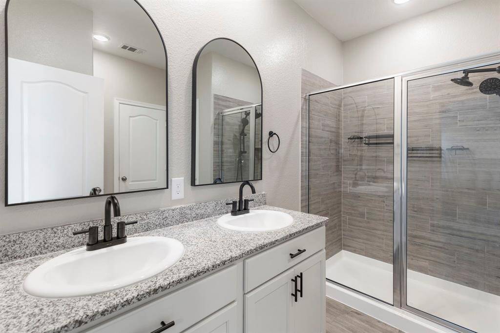 Oversize walk in shower in primary bathroom is another nice feature.