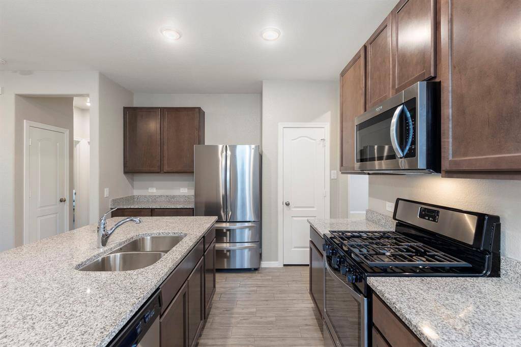 Gas range, microwave and dishwasher are some nice features in this home.
