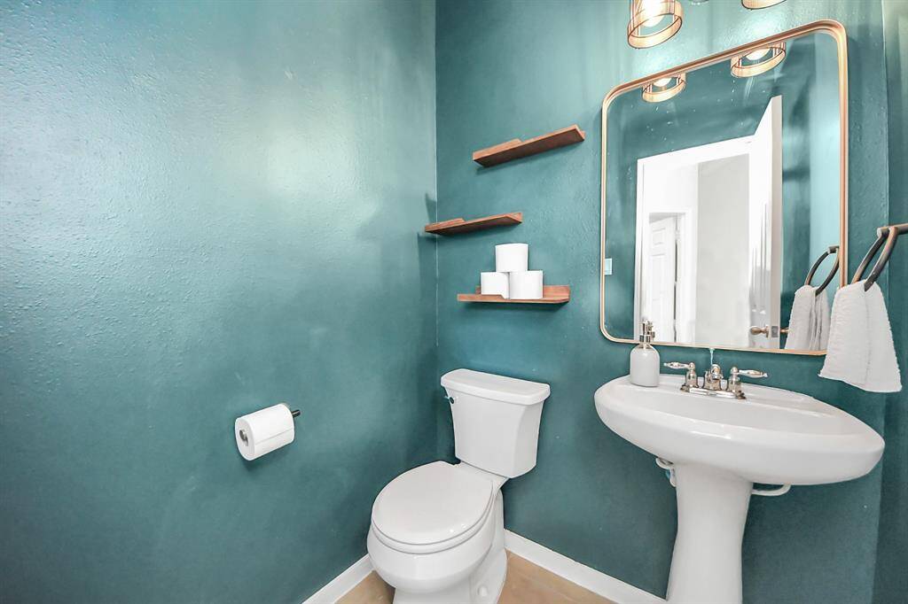Half bath located by the living room for guests!