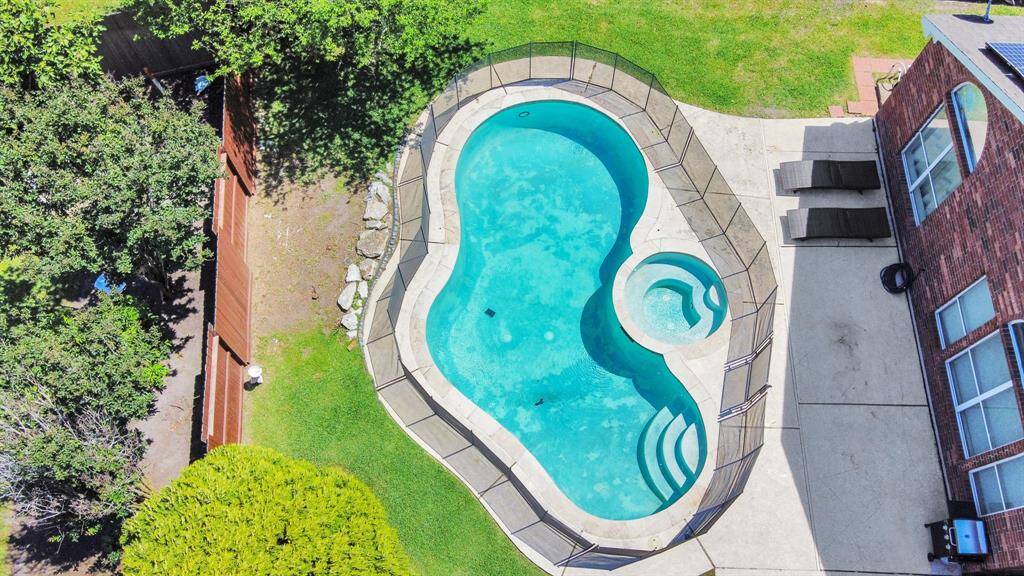 Dive into relaxation with a spacious backyard and a luxurious saltwater pool!