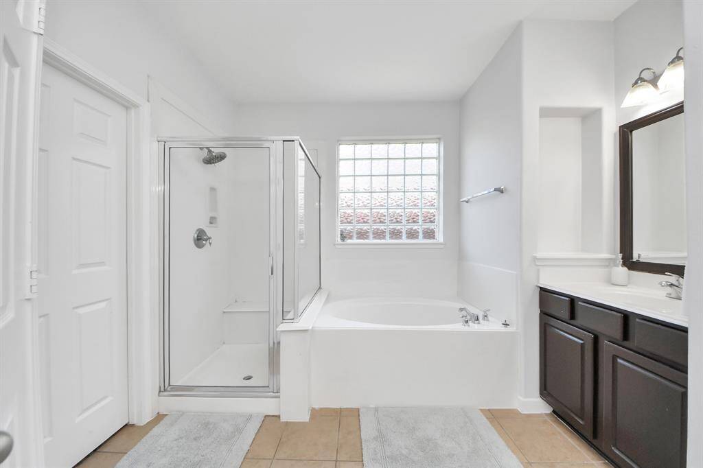 Separate shower and tub in the primary bathroom!