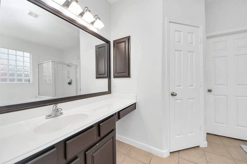 Streamline your morning routine in this primary bathroom!
