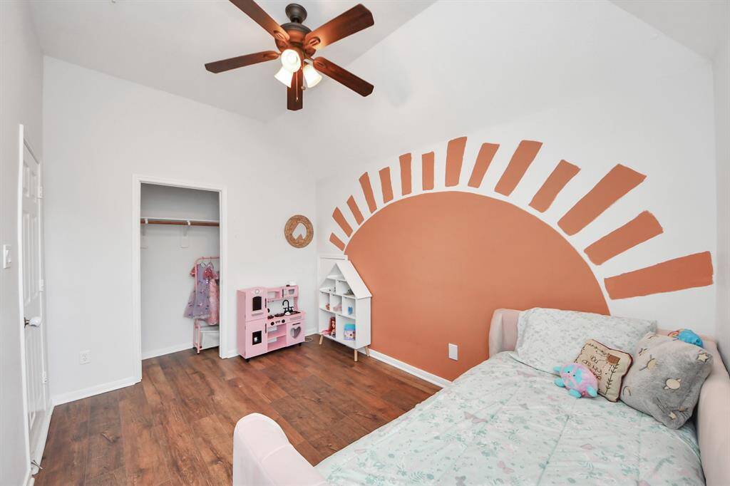 Second bedroom with vaulted ceilings and a ceiling fan!