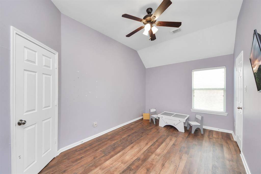 Third bedroom with vaulted ceilings and a ceiling fan!