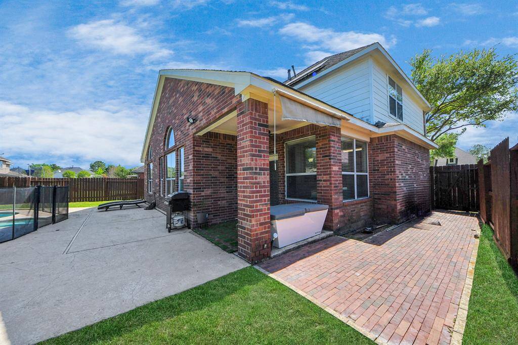 Spacious backyard with a covered patio!