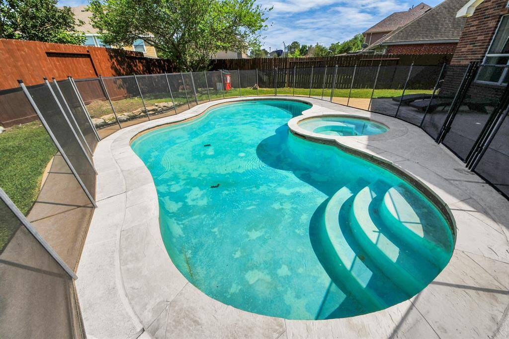 View of the saltwater pool and jacuzzi awaiting your enjoyment!