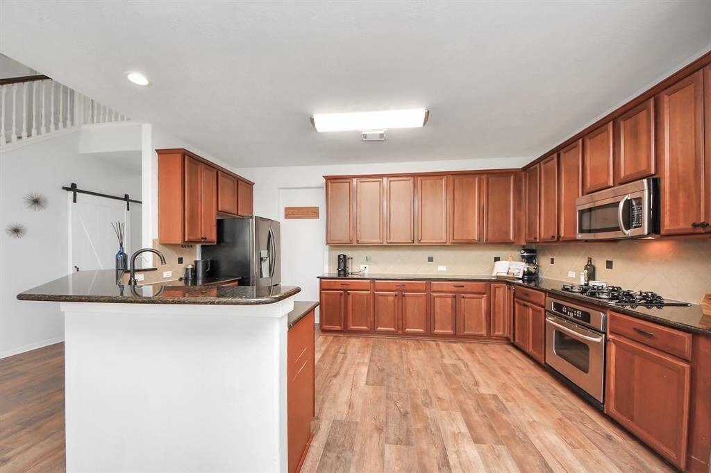 Granite counters and stainless steel appliances in the kitchen!