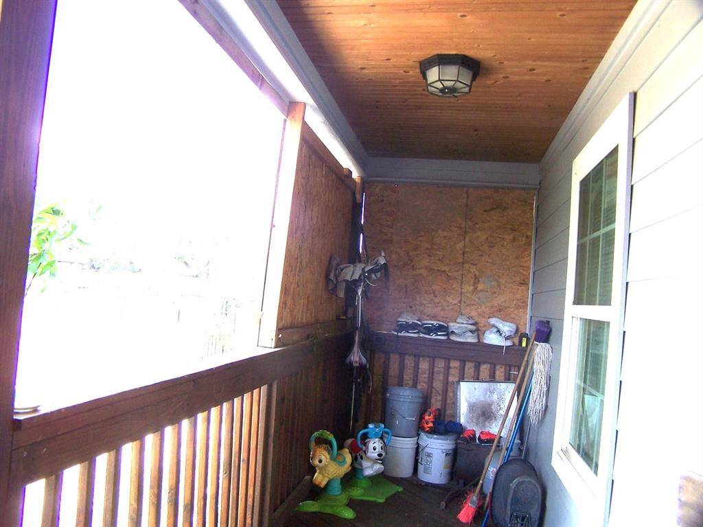 enclosed front porch of 1 of the homes