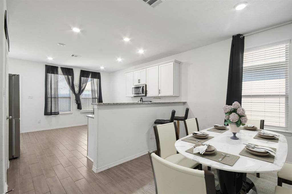 Virtually Staged: Enjoy a meal in this lovely dining area.