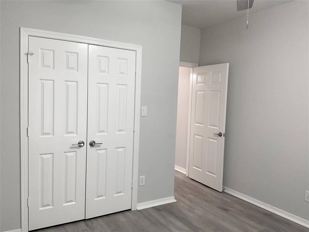 Split floor plan with the secondary bedrooms on the opposite side of the home.  Bedroom number two is freshly painted, new flooring, ceiling fan, double pane windows, plantation shutters and a double door closet.  Move in ready today!
