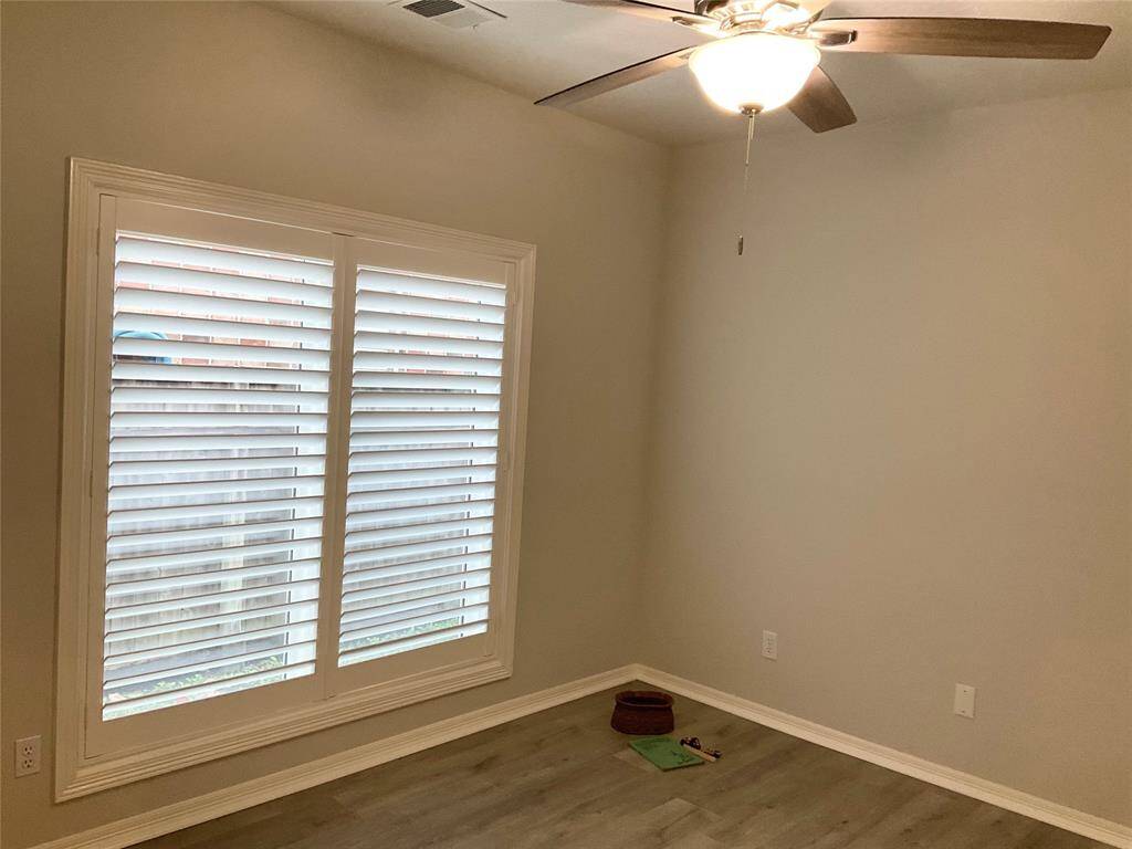 Bedroom number 3 or 4,  you decide.   It offers a double door closet and a lovely view of the back yard.  Move in ready today.