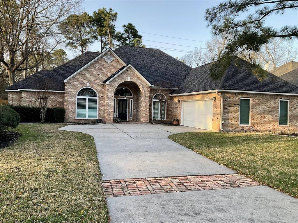 Charming, custom,  single-story, brick home with a welcoming arched entry and large double pane windows.  A spacious driveway leading to a two-car garage, surrounded by well-maintained lawns and mature trees for a serene setting.  The streets are curb and gutter, the home or streets have never flooded in Champion Lake.