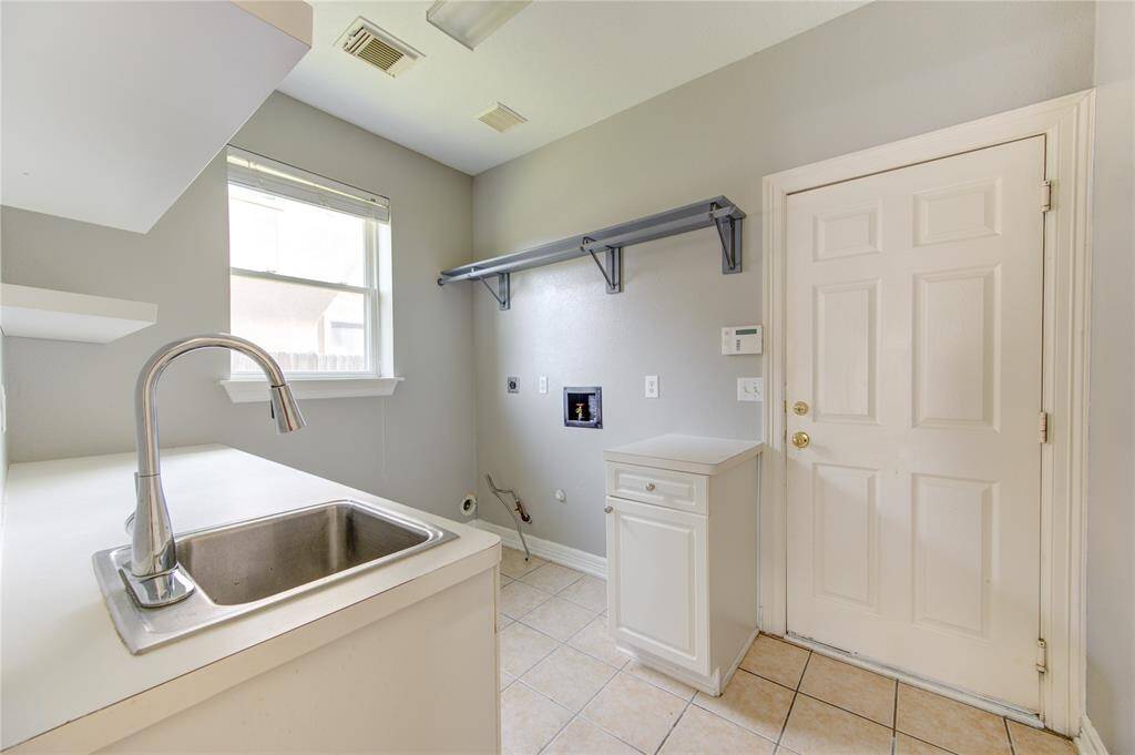 Large washroom for laundry with separate pre-treat sink basin