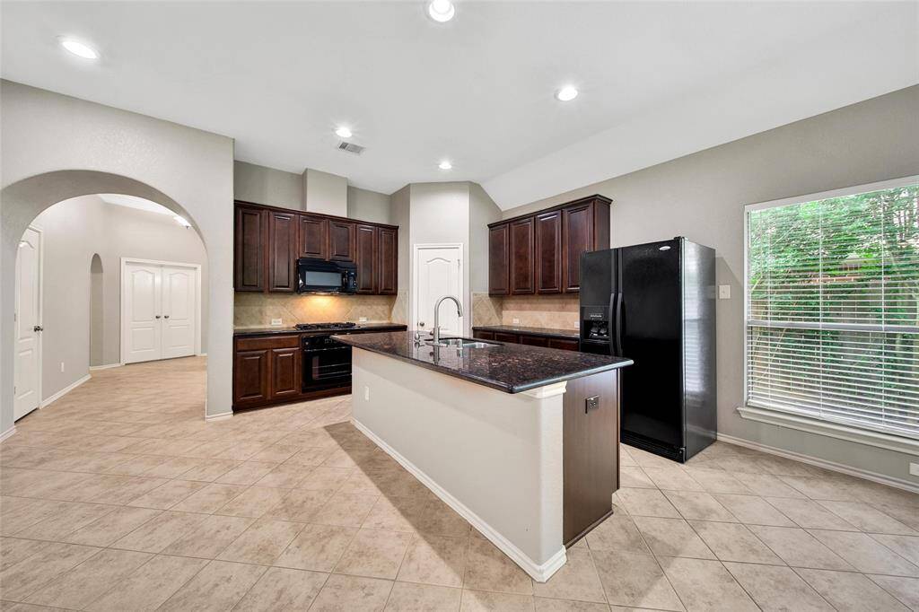 Another view of the beautiful granite kitchen. There's plenty of work space and storage.