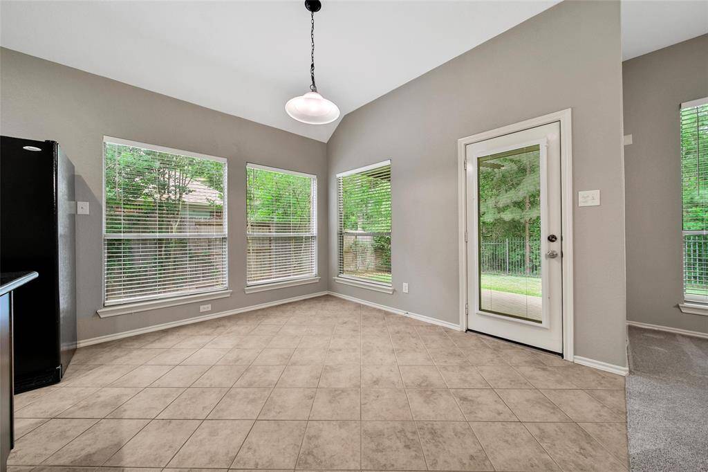 The casual dining area overlooks the greenbelt reserve for tranquil views.