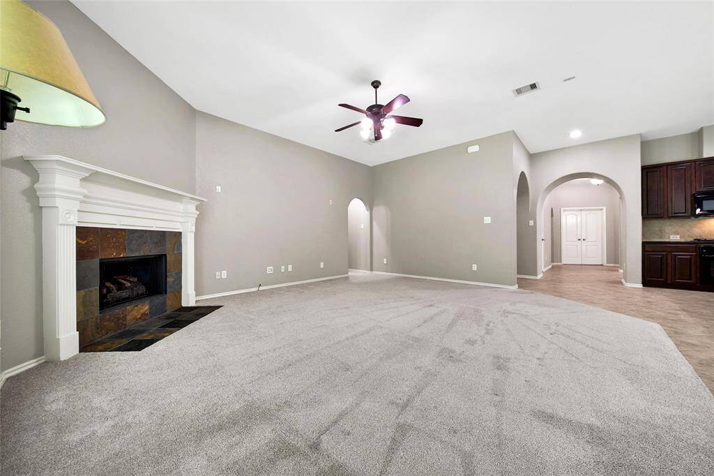 You'll love to cozy-up with the corner, gas-log fireplace.