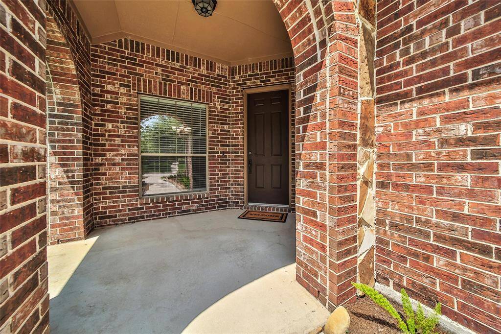 A large front porch and lush landscaping welcomes you and your guests home.