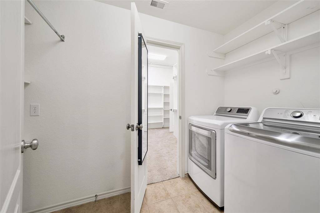 At the center of the home is the conveniently located laundry room.