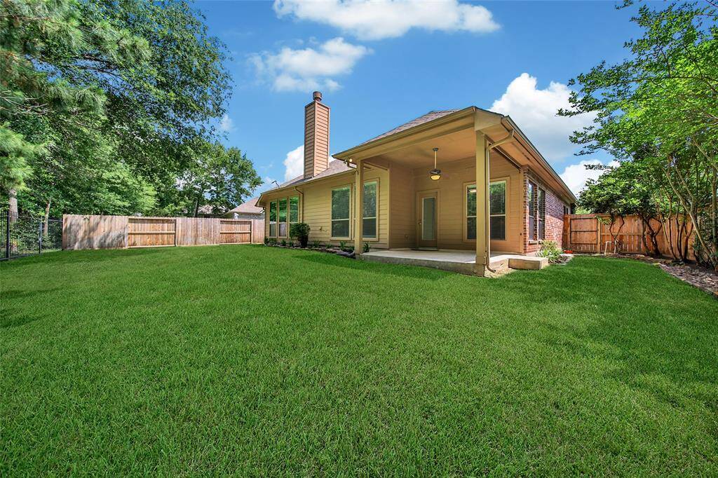 This large backyard is ready for kids and pets and there's even room for a pool!
