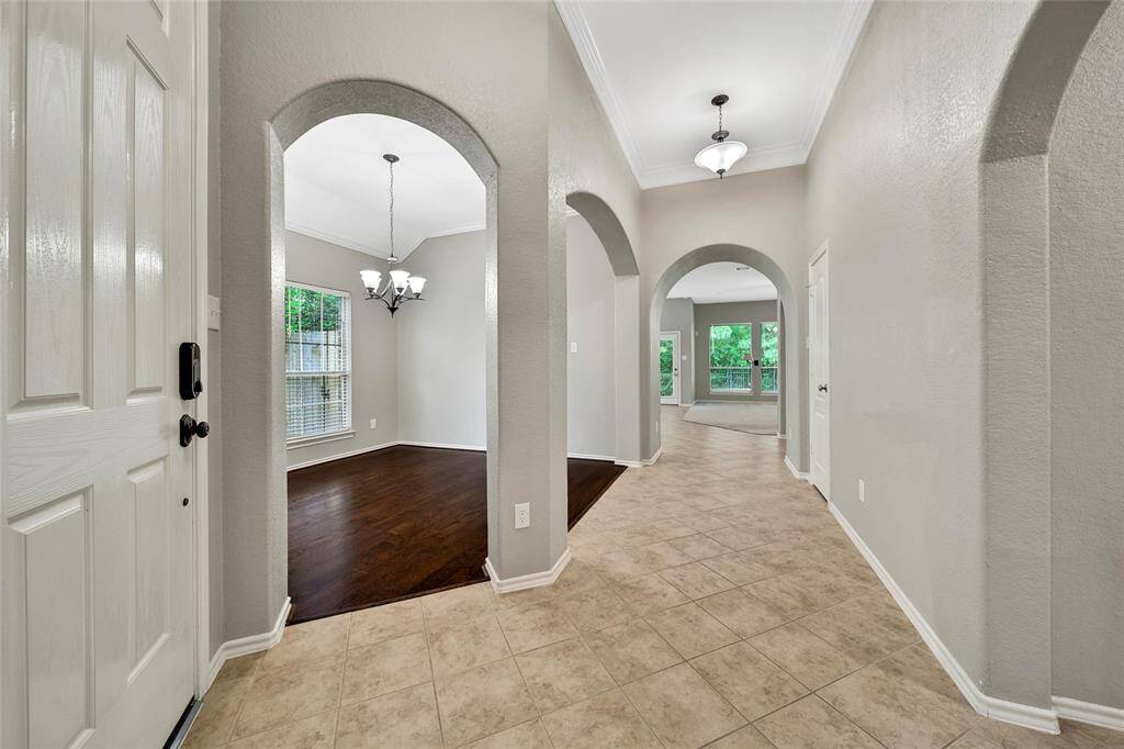 Step inside and appreciate the great natural light, high ceilings, and double crown molding that graces the entry.