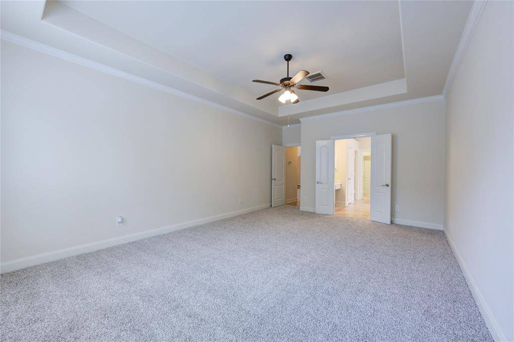 The primary suite  is ample and ready to make it your own retreat.