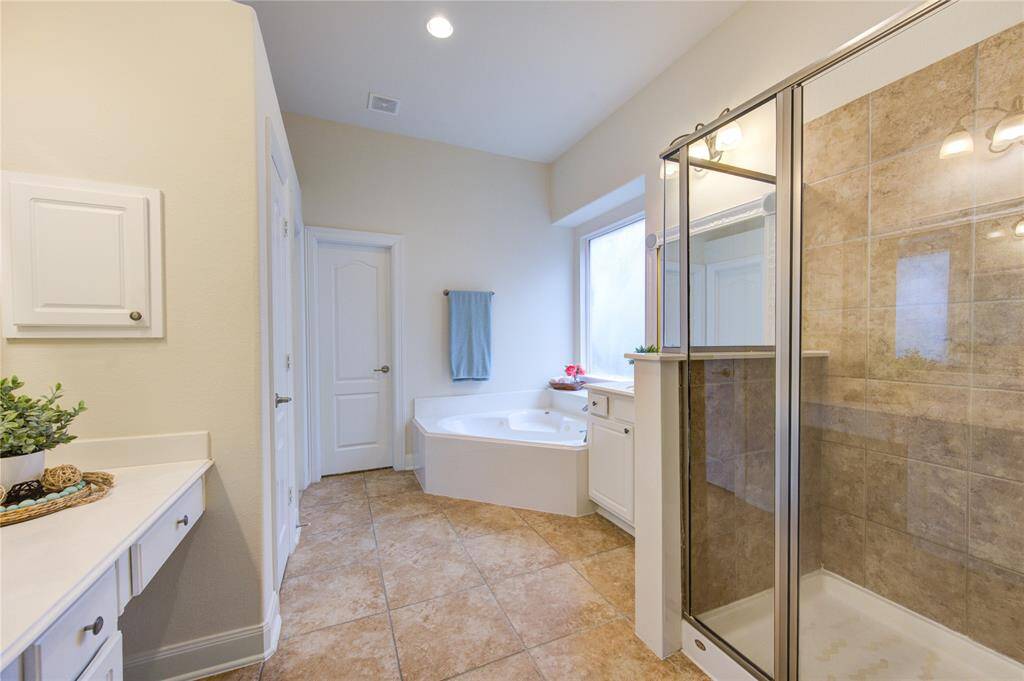 Favorite spot in the bathroom? Spacious shower and soaking tub.