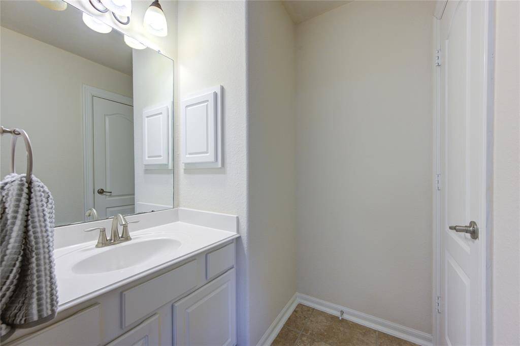The sink and cabinet area of the 3rd secondary bedroom
