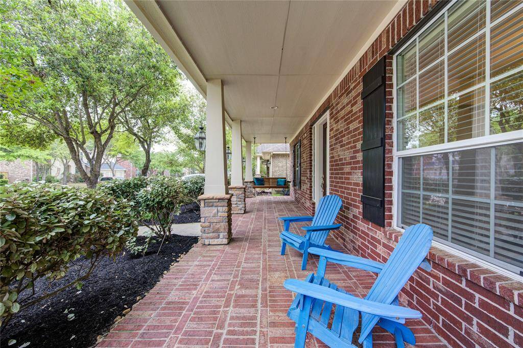 Want more? Relaex in the extended covered front porch.