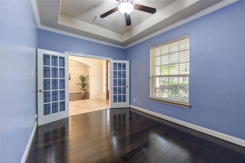 The private office is enhanced by French doors offers a pcreative place in your home.