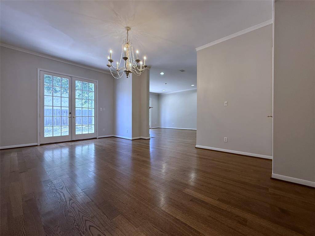 Alternate view of the dining room. French doors open in from the concrete patio & yard.