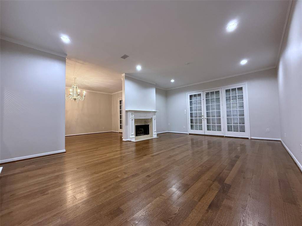 The dining room & living room doors/windows are each equipped with motorized window shutters. In this picture, the shutters are closed.