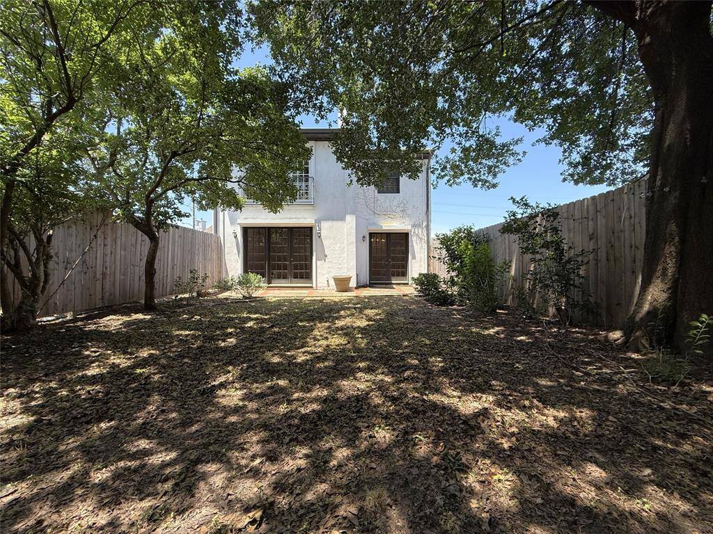The yard offers trees and privacy.